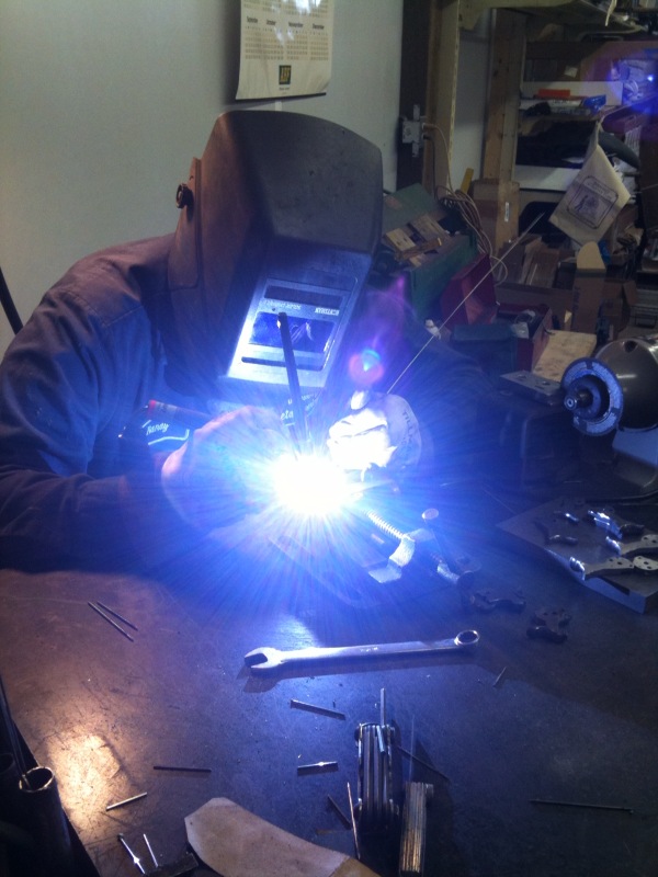 Randy Lee welding some Ruger half-cock hammers.