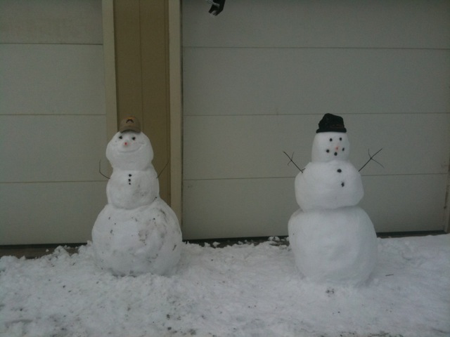 Snowmen greeting customers outside Cowboy Gunworks.