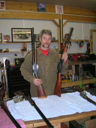 Jimmy Spurs in his workshop with an 1897 and an 1873.