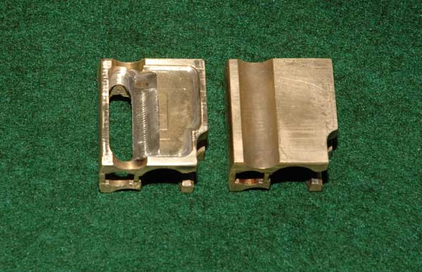 Photo showing a stock brass carrier on the right and a milled-out lighter version on the left.